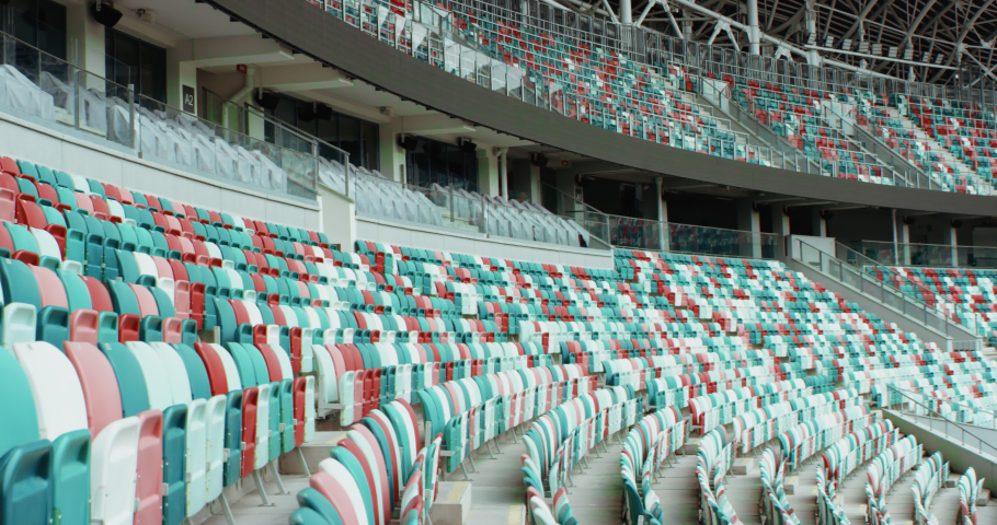 WIDE View of empty stadium seats before game or during Coronavirus COVID-19 pandemic. Shot on RED cinema camera Royalty-Free Stock Footage #1056090983