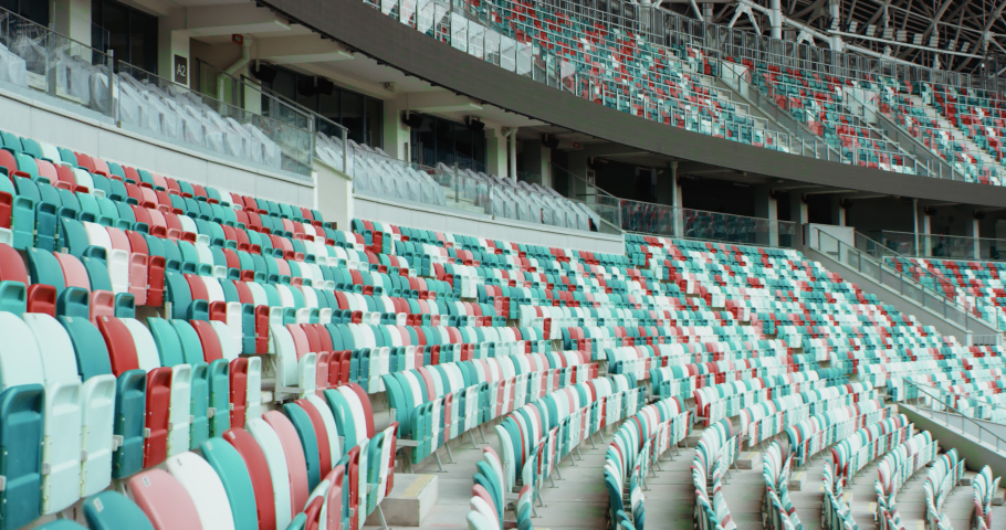 WIDE View of empty stadium seats before game or during Coronavirus COVID-19 pandemic. Shot on RED cinema camera | Shutterstock HD Video #1056090983