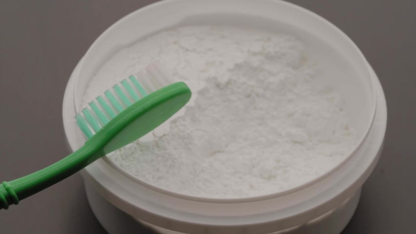 The dental powder applies to a toothbrush. The concept of Zero Waste, healthy teeth, eco-friendly Royalty-Free Stock Footage #1056092132