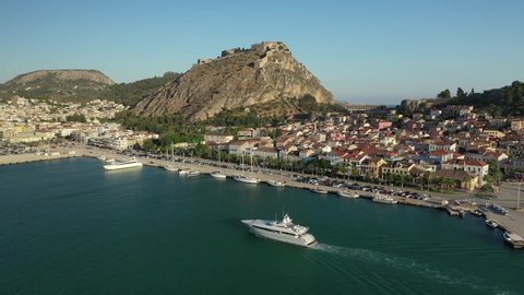 Aerial drone video of historic and picturesque seaside old town of Nafplio and famous Palamidi castle at the background, Argolida, Peloponnese, Greece