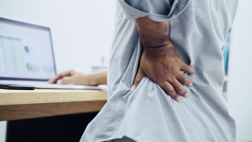 Office Syndrome. Close Up Shot. Salaryman working his computer suddenly he feeling pain in back and waist He try to relax and relieve by his hand. Slow Motion Shot. | Shutterstock HD Video #1056098897