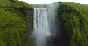 Skogafoss waterfall on Iceland - aerial video of Icelandic landscape. Famous tourist attractions and landmarks destinations in Icelandic nature on South Iceland. 4K UHD video.