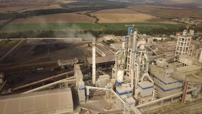 Aerial view of cement plant factory at industrial production area. Royalty-Free Stock Footage #1056100751
