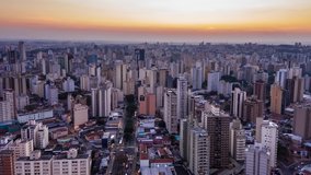 city of Campinas seen from above in the Cambuí neighborhood, flying backwards, São Paulo, Brazil, hyperlapse, sunset in Campinas, technological city, hyperlapse drone movement backwards