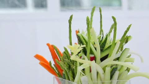 appetizer of vegetables, cutting, asparagus, carrots, radishes, cucumbers