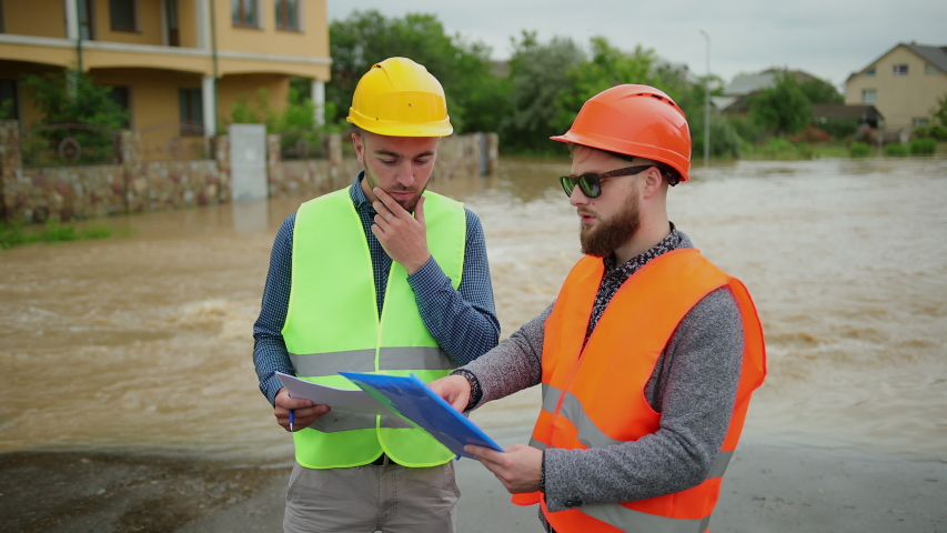 two male engineers solve flood problem Stock Footage Video (100% ...