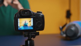 Artist testing camera lens while recording vlog episode in studio. Camera lens technology digital recording social media influencer content creator, professional studio for podcast, vlogging and