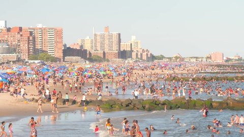 NEW YORKUSA, JULY 11, 2020: Crowded beach in Coney Island - people enjoy beach time 