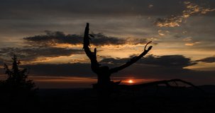 timelaps - gnarled tree at sunrise with clouds - Powered by Shutterstock - Get 15% off with code: PIKWIZARD15
