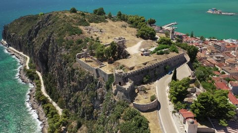 Aerial drone rotational video of historic and picturesque seaside old town of Nafplio as seen from Palamidi castle, Argolida, Peloponnese, Greece