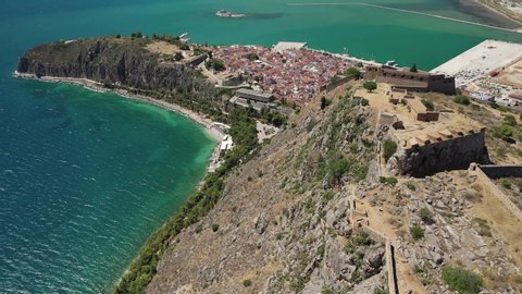 Aerial drone rotational video of historic and picturesque seaside old town of Nafplio as seen from Palamidi castle, Argolida, Peloponnese, Greece