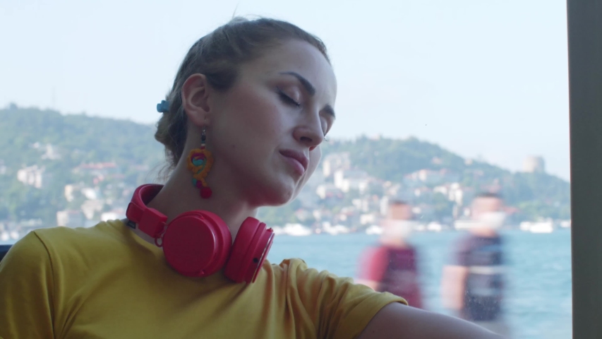 Young woman sleeping on the bus.