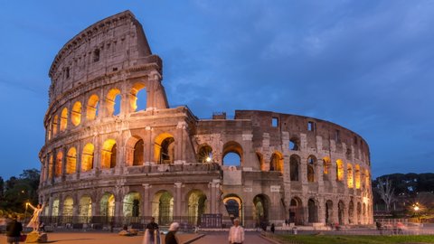 ROME, ITALY - CIRCA 2018: The Colosseum or the Flavian Amphitheatre, one of the most famous landmarks of Rome. Day to night time lapse video.