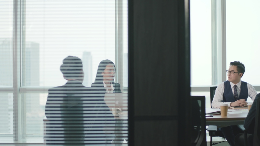 group of asian business people meeting in modern office conference room Royalty-Free Stock Footage #1056147308