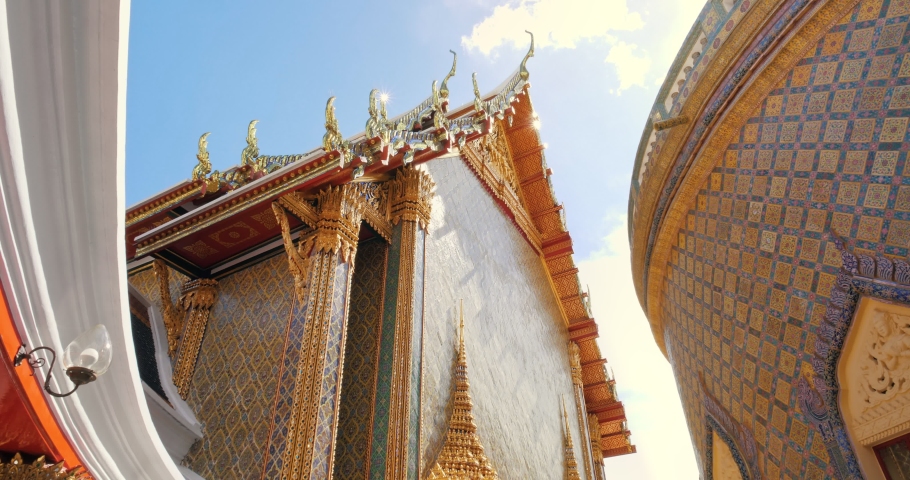 Thai temple Wat RatchaBophit Buddhist royal temple of Bangkok Thailand looking up with light ray. Beautiful temple travel in Thailand concept. Royalty-Free Stock Footage #1056148757