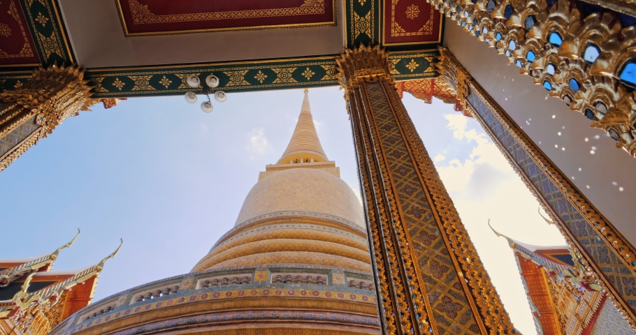 Pagoda of Wat RatchaBophit Buddhist royal temple of Bangkok Thailand looking up with light ray. Beautiful temple travel in Thailand concept. Royalty-Free Stock Footage #1056148763