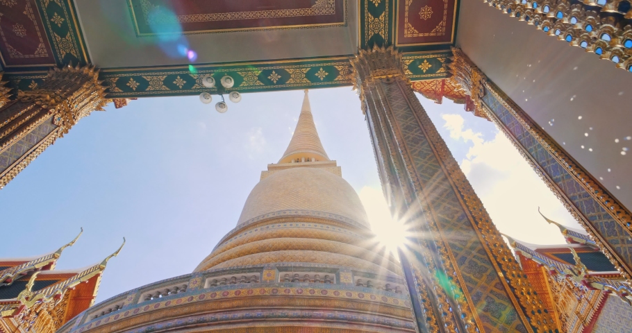 Pagoda of Wat RatchaBophit Buddhist royal temple of Bangkok Thailand looking up with light ray. Beautiful temple travel in Thailand concept.