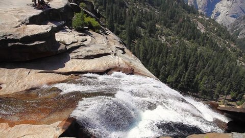 close up of Nevada Fall waterfall on Merced River from Mist Trail in Yosemite National Park. Summer travel holidays in California, United States.