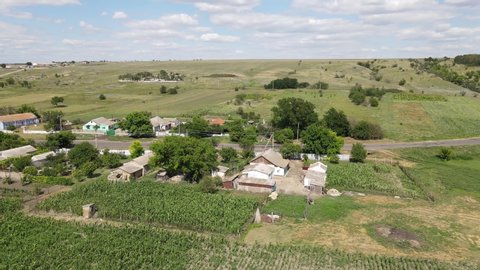A typical steppe village in the South of Ukraine. The central street, one-story houses without architecture, vegetable gardens and a church on the hill.
