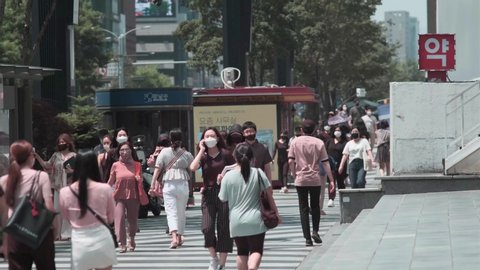 Seoul/South Korea - 2020 - Korean workers walking in Gangnam during Covid-19