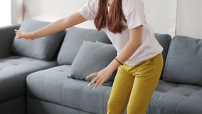 Excited young asian woman gamer wearing virtual reality having fun enjoy playing motion sensing interaction vr game in living room at home.
