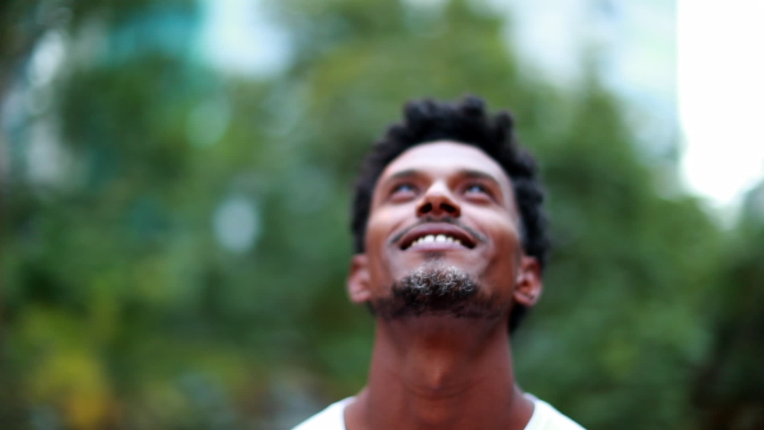 Man looking to the sky feeling hopeful outdoors Royalty-Free Stock Footage #1056178205