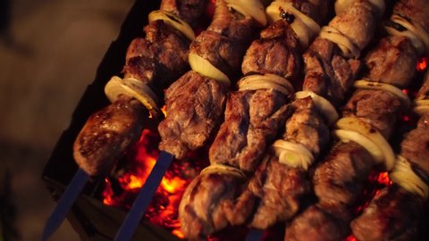 shish kebab on skewers on the grill. Close up