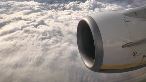 Close up Airplane Jet Engine Inlet Flying above Clouds