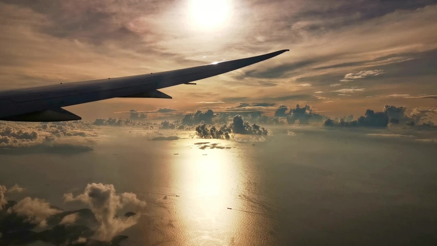 Aerial view of beautiful sunrise from airplane | Shutterstock HD Video #1056203642