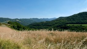 Panoramic view with cultivated fields from the top of the Mount Brusca located on the Apennines Tosco-Romagnolo, italy. 