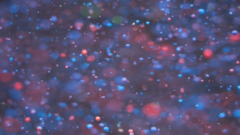 Neon Bubbles Oil Beautiful Paint Universe Color Moving Multicolored. Holiday Background. Christmas. Galaxy Nebula Space Stars Planets. Blue Neon. Fantastic surface with Chaotic motion liquid.