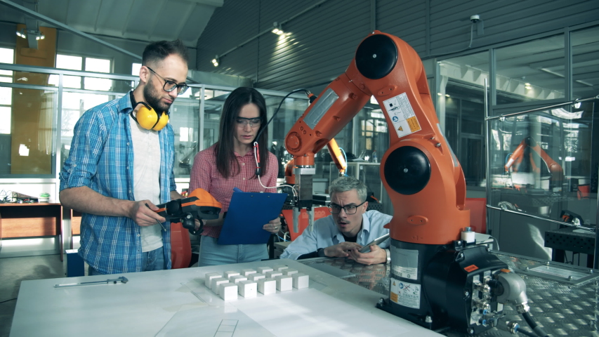 Science school students are holding an experiment with robots Royalty-Free Stock Footage #1056210386
