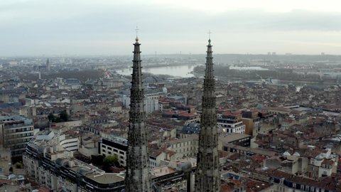 Bordeaux Cathedral of St. Andrew in France fly-through spires with golden crosses on top, Aerial drone in-between shot