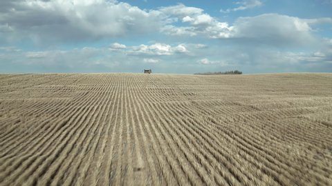 Seeding Machinery On The Broad Farm In Saskatchewan, Canada On A Bright Weather - fast drone shot