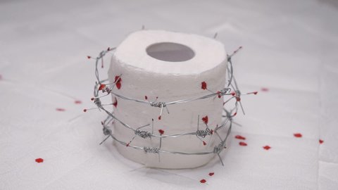 Toilet paper with blood. Concept: hemorrhoids, diarrhea, constipation