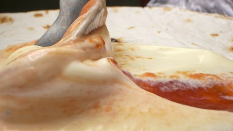 super close up. mayonnaise and ketchup on pita bread. cooking process.