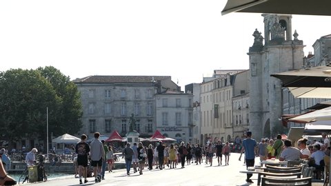 La Rochelle, France - 07 21 2020 : 
La Rochelle, people in the street. Wearing a mask is mandatory.