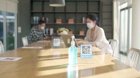 Seats Check in QR code sign and Alcohol gel for hand sanitizing point. Check in and cleaning hand before use co working space or flexible office. Lifestyle and work after corona virus (Covid-19).