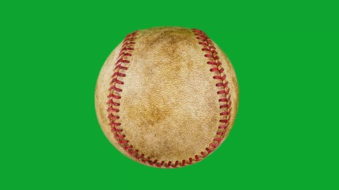 close-up of one old baseball rotating on green screen background