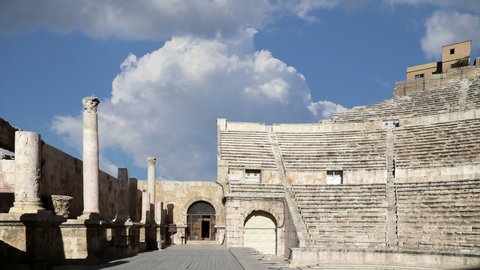 Roman Theatre against the background of moving clouds in Amman, Jordan -- theatre was built the reign of Antonius Pius (138-161 CE), the large and steeply raked structure could seat about 6000 people