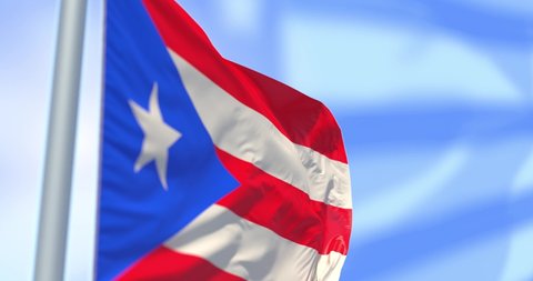 Puerto Rico flag on a flagpole on USA flag background waving in the wind in the sky. Wonderful intro for yor projects. The Commonwealth of Puerto Rico. in The United States of America.