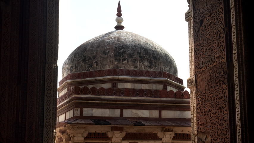 DELHI, INDIA - MARCH 12, 2019: a tilt down shot of alai darwaza gate at qutub minar complex