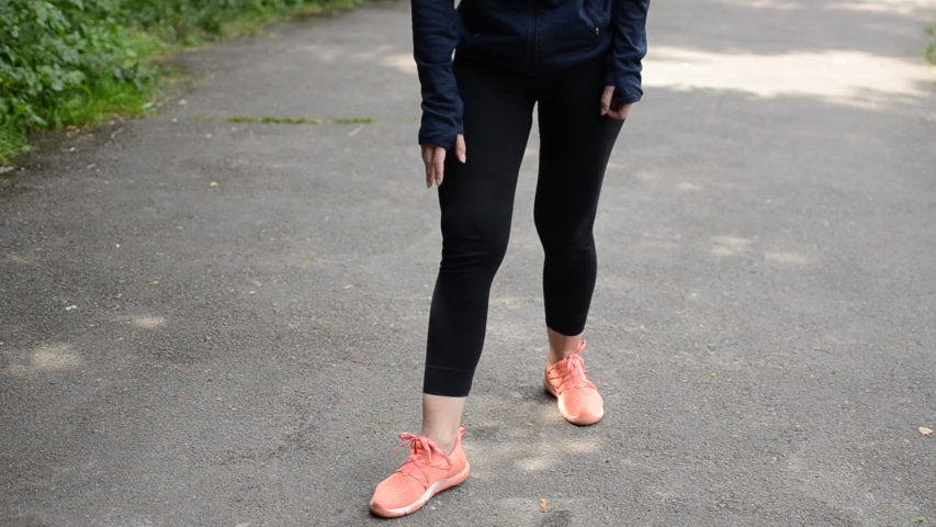 Young woman doing sports on the street