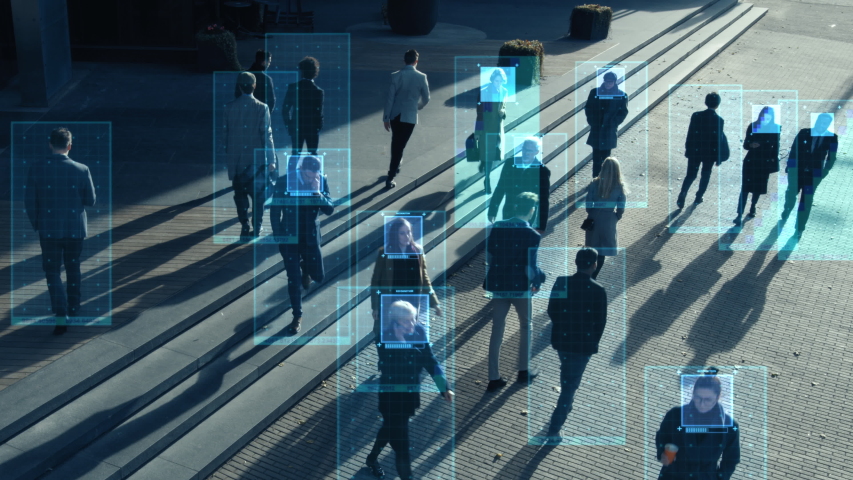 CCTV AI Facial Recognition Camera Zoom in Recognizes Person. Elevated Security Camera Surveillance Footage Face Scanning of a Crowd of People Walking on Busy Urban City Streets. Big Data Analysis | Shutterstock HD Video #1056263531