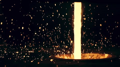 Hypnotizing Beautiful Yellow Stream of Hot Liquid Molten Steel and Bright Sparks Against the Black Background. Metal is Pouring into Huge Vessel, Modern Iron Manufacture Industry, Slow Motion