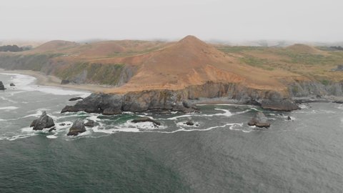 Expansive aerial view of a large hill along the Sonoma Coast in California.