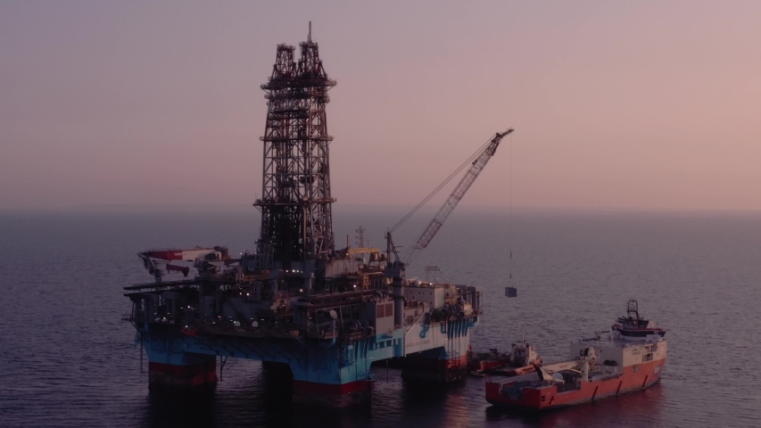 Maersk Discoverer drilling rig at sunset Royalty-Free Stock Footage #1056279098