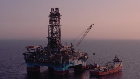 Maersk Discoverer drilling rig at sunset