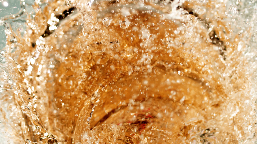 Beautiful slow-motion splashing. The yummy syrupy liquid in 1000+ fps. Works for cider, beer, prosecco, pink wine, apple juice, juice, rum, liquor, rye whiskey. Refreshing cold beverage. Royalty-Free Stock Footage #1056279680
