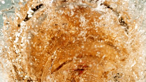 Beautiful slow-motion splashing. The yummy syrupy liquid in 1000+ fps. Works for cider, beer, prosecco, pink wine, apple juice, juice, rum, liquor, rye whiskey. Refreshing cold beverage.